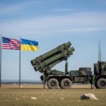"Patriot air defense system on a military vehicle with U.S. and Ukraine flags in the background, as the U.S. approves a $179 million deal to provide Ukraine with modern defense weapons — Mine Bridge Bahawalpur News."